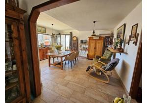 For sale: Large modern house with industrial barns, suitable for many activities.