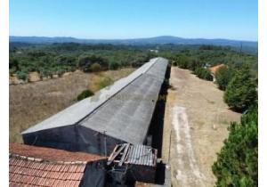 For sale: Large modern house with industrial barns, suitable for many activities.
