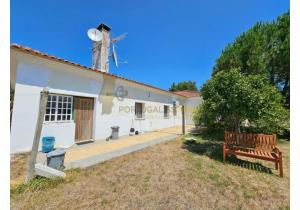 For sale: Large modern house with industrial barns, suitable for many activities.
